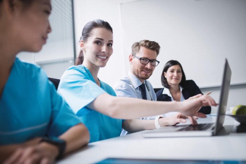 doctors-discussing-laptop-meeting Globalquest Solutions